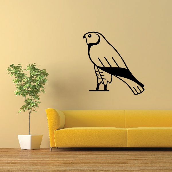 Egyptian falcon wall decal in black and yellow with stylized wings and legs