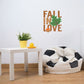 Die-cut wall decal printed with 'FALL IN LOVE' and a green leaf accent