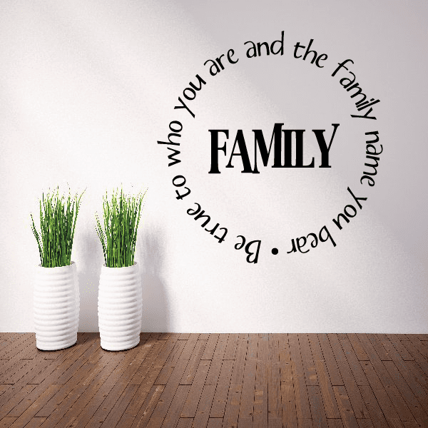 Wall decal with large word FAMILY and surrounding curved text, black on light wall