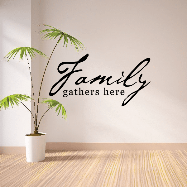 Wall decal with cursive Family and gathers here text plus palm leaves