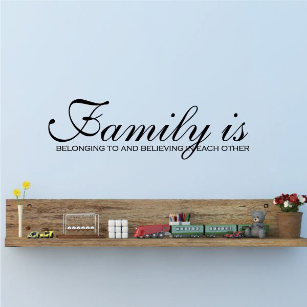 Family wall decal reading “Family is” and “Belonging to and believing in each other”