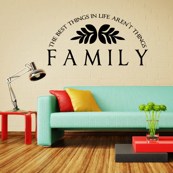 Black vinyl wall decal showing FAMILY with quote text and leaf accents