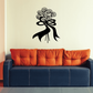 Black floral bouquet wall decal with curled ribbons and bow above sofa