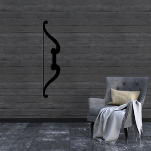 Fancy bow decal in dark black, curved decorative outline on a wall