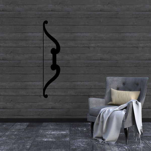 Fancy bow decal in dark black, curved decorative outline on a wall