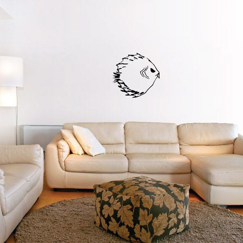Fanged piranha decal, black finned head silhouette on white surface