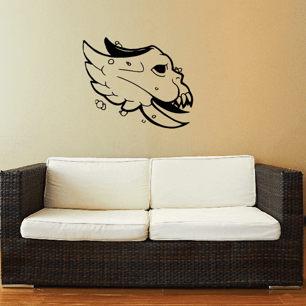 Winged skull mask decal with fanged grin, black outline and details