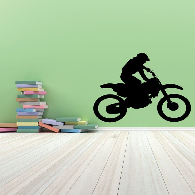 Dirt bike decal with rider silhouette on black motorcycle