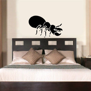 Black beetle crawling decal with outlined legs and antenna.