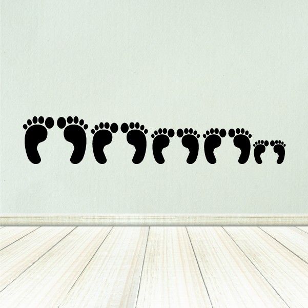 Black footprint wall decal strip with multiple foot shapes for family