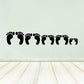 Black footprint wall decal strip with multiple foot shapes for family