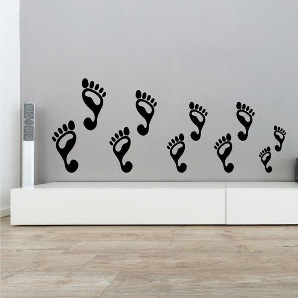 Footprint family decal set with nine dark footprints