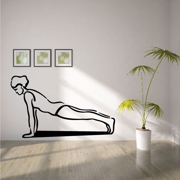 Fitness wall decal of a woman doing push-ups, black vinyl silhouette