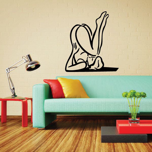 Yoga stretching wall decal showing a black outline of a seated woman stretch pose