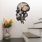 Alien skull sticker with helmet-like head and detailed teeth, black and tan outline