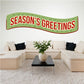 Season's Greetings banner sticker with green curved ribbon and red border