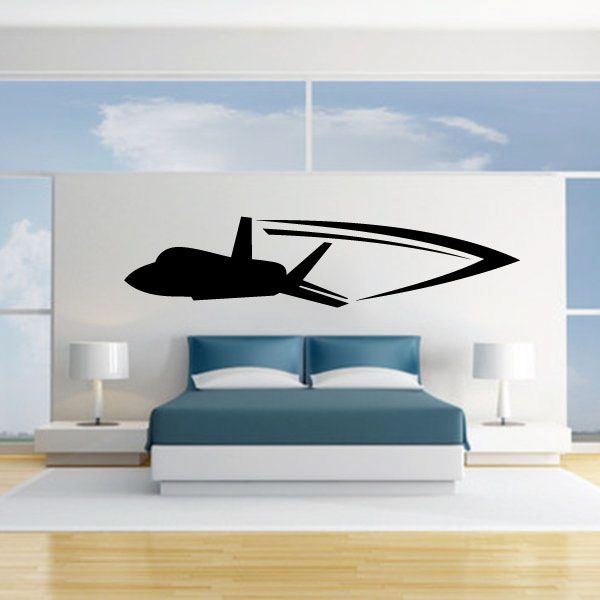 Fighter jet flyby wall decal, black jet silhouette with pointed nose and wings.