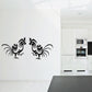 Black fighting rooster wall decal with two facing roosters and decorative swirls