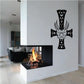 Black ornate cross wall decal with demon mask face and decorative scroll details