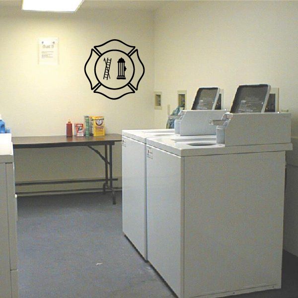 Firefighter ladder crest decal with black outlined emblem and ladder/building icon