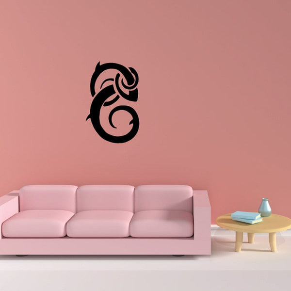 Black stylized fish wall decal in a swirl design