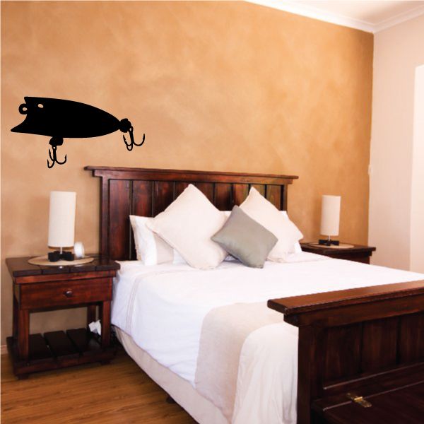 Fishing lure wall decal, black lure with three hook accents on wall