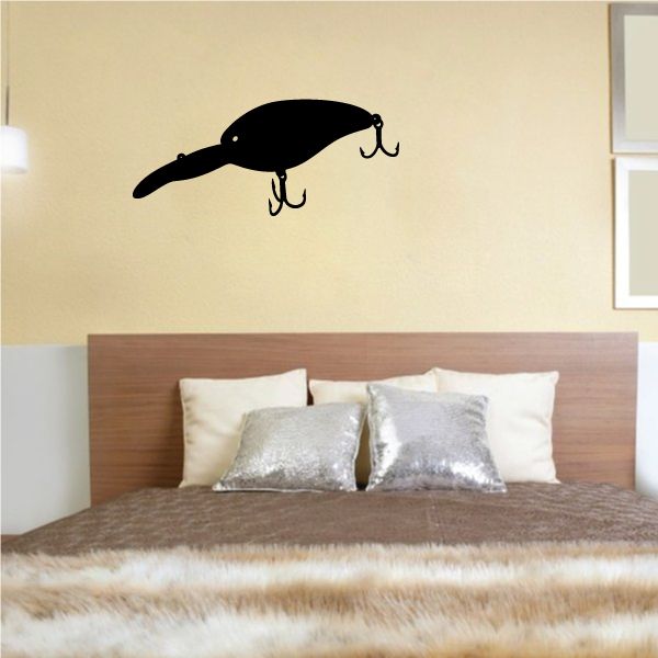 Black fishing lure wall decal with two hook accents and metal eyelets