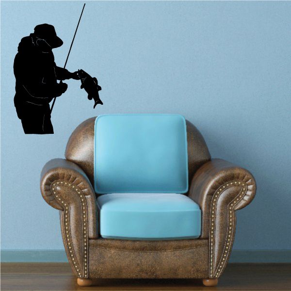 Fishing lure wall decal featuring a black cowboy fishing with a rod and line.