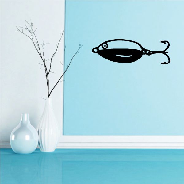 Fishing lure wall decal with black minnow shape and hook eyes