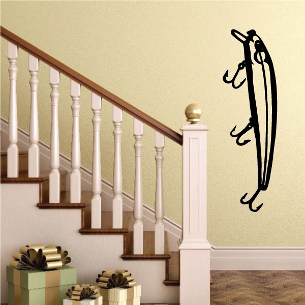 Fishing lure wall decal, black lure and hooks silhouette on light wall