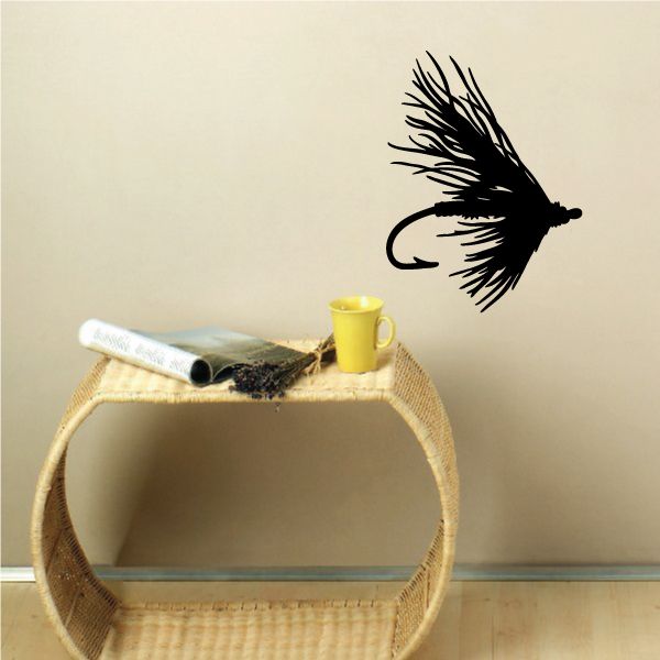 Vinyl fishing lure wall decal featuring a black fish silhouette with hook