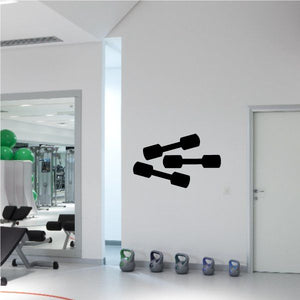 Vinyl wall decal of three black dumbbells