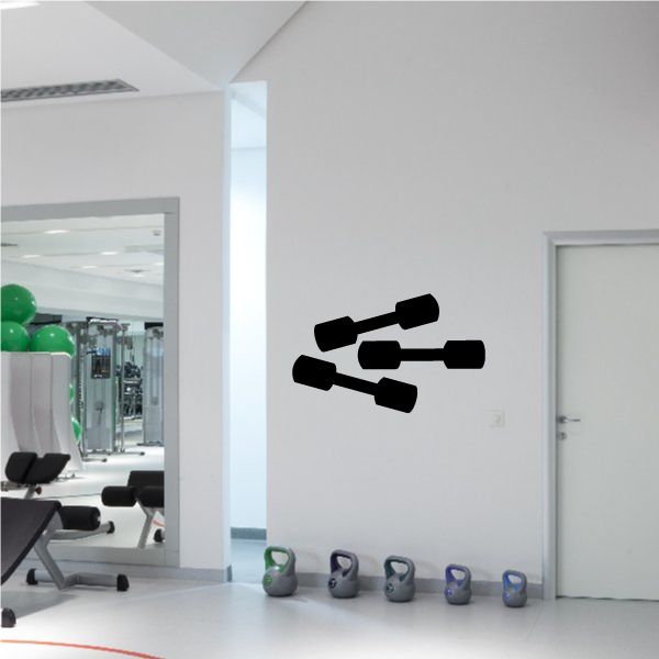 Vinyl wall decal of three black dumbbells