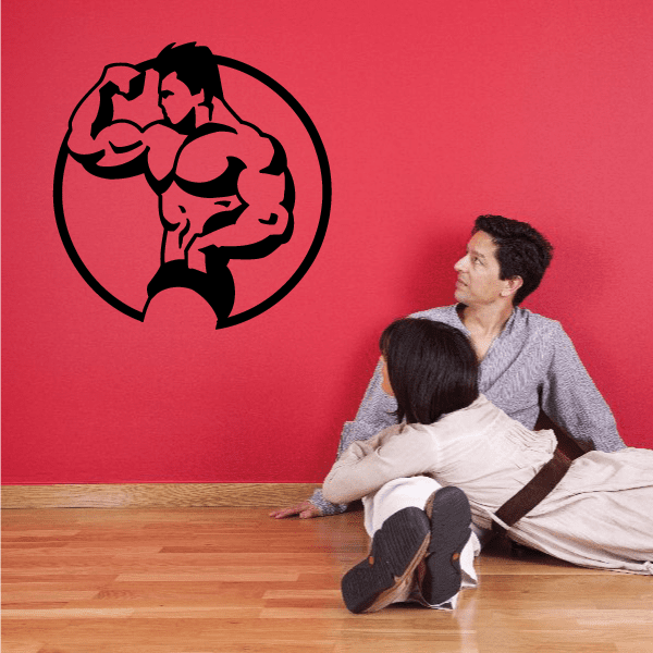 Black vinyl fitness wall decal of a flexing bodybuilder inside a circle