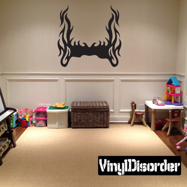 Flame wall decal with mirrored flame tips and curved center bar in black