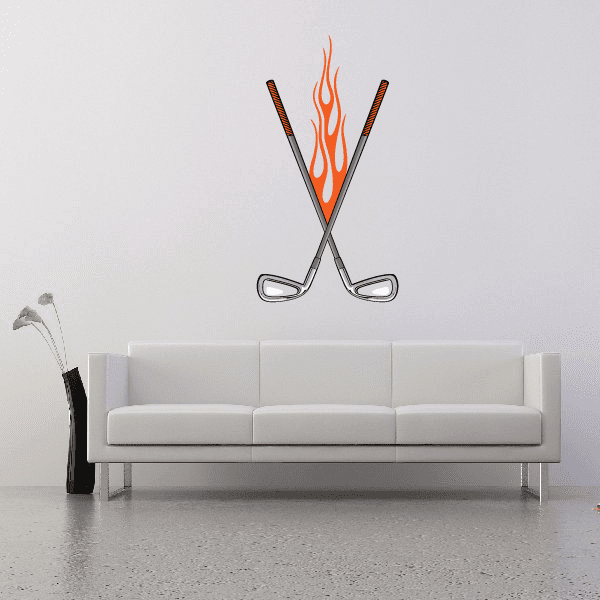 Flaming golf wall decal of two crossed clubs with orange flames