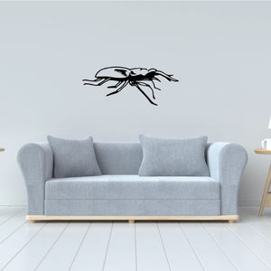 Flat horned beetle decal, black outline beetle with long horn antennae.