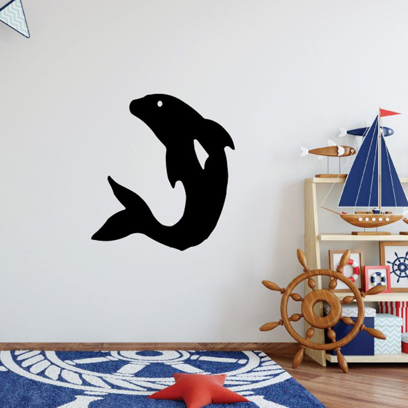 Black flipping dolphin wall decal with white eye dot