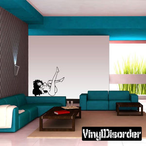 Wall decal of black female figure in playful pose with stylized text