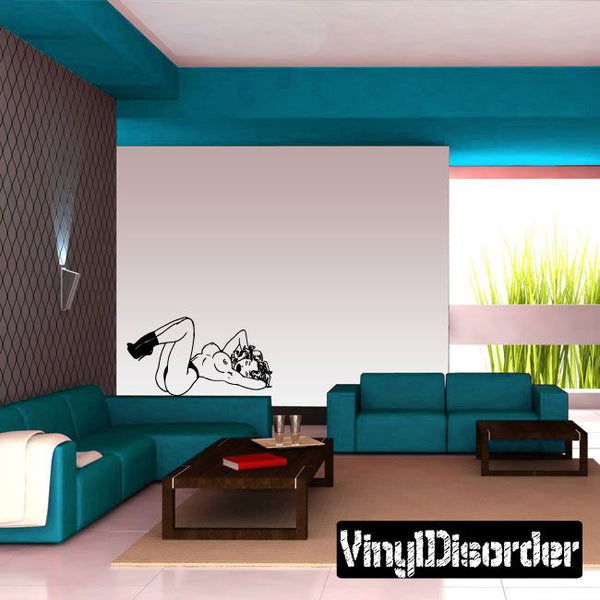 Pinup-style decal with cartoon figure and decorative text, black and white