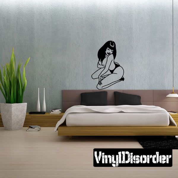 Seated woman vinyl decal with long hair, arms resting on knees, black line art