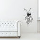 Black dragonfly wall decal with long legs and droplet-shaped wings