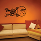 Black moon face wall decal with floating floral leaves and flowers