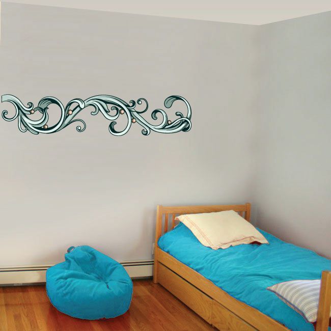 Floral frame wall decal with teal ornamental scrollwork across wall