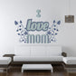 Wall decal with blue Love Mom lettering and floral vine accents