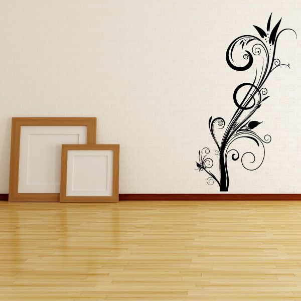 Black floral swirl wall decal with scrollwork and small blossoms