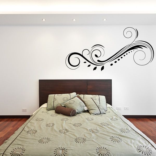 Black ornamental swirl wall decal with curved flourishes and dotted accents