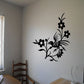 Black flower and bird wall decal with leafy stems and blossoms