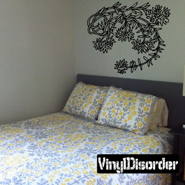 Flower branch vinyl wall decal with outlined blooms and curved leaves cluster