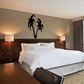 Black floral vine wall decal with curving petals and stems